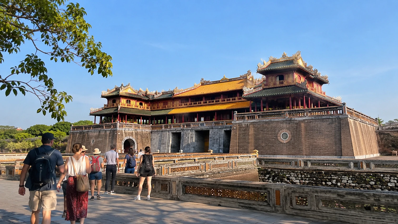 Imperial Citadel of Hue, Vietnam, with visitors exploring the historic palace grounds on a self-guided cultural adventure.